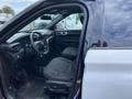 Interior view of a 2021 Ford Explorer showing front seats steering wheel and dashboard