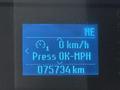 Dashboard display of a 2017 Ford F-350 SD showing speed as 0 km/h and odometer reading of 075734 km with directional indicator pointing north