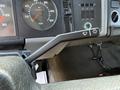 The interior dashboard of a 1994 Volvo FE 42 featuring a gear selector and various dials including speedometer and fuel gauge