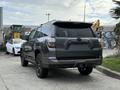 2021 Toyota 4Runner in gray with black accents parked with a view of its rear and side profile