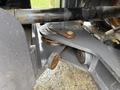 Close-up of the undercarriage of a 2018 Doosan DL300-5 showcasing a metallic arm with a pivot point and attached components