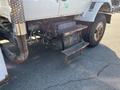 2007 International 7300 truck featuring a visible engine compartment with metal steps and exhaust pipe