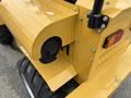 A close-up view of a yellow 2024 AGT Industrial KRW23 Mini Loader showing the rear side with a fuel cap and a red taillight