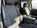 Interior of a 2023 Toyota Tundra showing the front seats and center console with a focus on the fabric and design elements of the seating