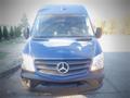 A blue 2017 Mercedes-Benz Sprinter van facing forward with a prominent star emblem on the grille and large front windows