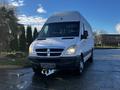 2008 Dodge Sprinter Van with a white exterior and a high roof parked in a driveway