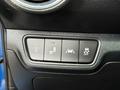 Controls for various vehicle features including headlights parking sensors and traction control in a 2021 Kia Forte