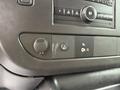 Control panel of a 2021 Chevrolet Express featuring buttons for various functions including an off switch and audio controls