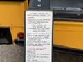 A close-up of a label on a 2014 Freightliner B2 outlining safety warnings and operating instructions for wheelchair and standee lifts