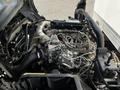 Engine of a 2020 Hino 155 showing various components including the intake manifold turbocharger and cooling system parts
