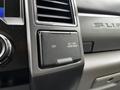 A close-up of the dashboard of a 2020 Ford F-350 featuring a power outlet labeled 12V AC 110V 400W MAX