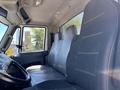 Interior view of a 2018 International DuraStar truck showcasing two sleek black upholstered seats and a partially visible steering wheel