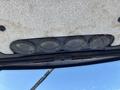 The image shows the interior ceiling of a 2010 New Holland T4050 tractor with four circular air vents arranged in a row