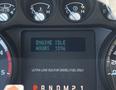 2014 Ford F-250 SD dashboard with engine idle display showing hours at 1098 and warning lights for turbo pressure and temperature