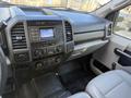 Interior dashboard of a 2020 Ford F-550 featuring controls for audio climate and navigation with a focus on the Super Duty branding