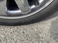 A close-up of a tire on a wheel from a 2007 Chrysler PT Cruiser with visible details of the tire tread and rim design