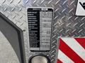 A vehicle information plaque on a 2006 E-One Typhoon listing specifications such as engine coolant type, transmission, power divider, and various fluid capacities