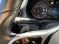 A close-up view of the steering wheel and control stalk of a 2023 Mercedes-Benz Sprinter showing the speedometer and dashboard display
