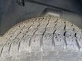 Close-up of a rugged tire showcasing deep treads on a 2017 RAM 1500 indicating off-road capability and durability