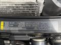 Image of a 2008 Ford F-550 engine compartment showing a label detailing the air conditioning system specifications and refrigerant information