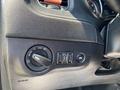 A close-up view of the interior controls of a 2019 Dodge Charger showing the headlight switch and other buttons on the driver's side dashboard