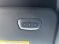 A control panel in a 2019 RAM 1500 featuring buttons for functions such as window or door operation