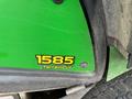 2014 John Deere 1585 TerrainCut mower with a green exterior and a yellow identification label displaying the model number and name