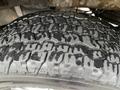Tire of a 2016 Ford F-150 showing a rugged tread pattern with visible grooves and texture