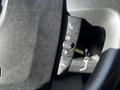 Close-up of the steering wheel controls of a 2021 RAM Promaster featuring buttons for phone and directional adjustments