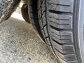 Close-up of two tires on a 2018 Chevrolet Express showing tread patterns and rubber texture