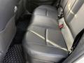 A 2021 Toyota C-HR featuring a spacious backseat with black leather upholstery and seat belts