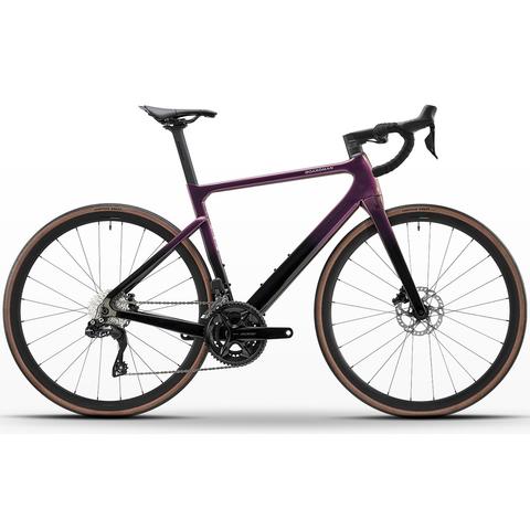 A 2026 Boardman SLR 9.2 Carbon Race Road Bike featuring a sleek purple and black frame disc brakes and thin tires designed for speed and performance