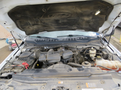 The engine compartment of a 2017 Ford F-250 SD with the hood raised displaying the engine components and various mechanical parts
