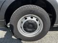 Close-up of a wheel and tire from a 2022 Ford Transit showcasing a rugged Goodyear Wrangler tire on a gray rim