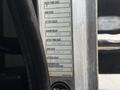 A label attached to a metal frame displaying specifications for a 2020 Peterbilt 330 including tire and rim sizes as well as weight ratings
