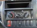 Control panel of a 2014 Hino 195 featuring knobs for air conditioning and ventilation settings along with buttons for additional functions