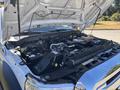 A 2016 Ford F-550 with its hood raised showcasing the engine compartment and components such as the battery hoses and radiator