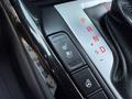 Interior console of a 2024 Kia Forte5 featuring gear shift and heated seat controls