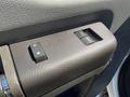 Close-up of the power window control panel in a 2014 Ford F-250 SD showing two switches for window operation
