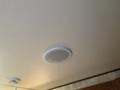 A ceiling-mounted speaker in a 2015 Winnebago Indiana Travel Trailer