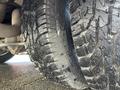 A close-up of a wet tire from a 2017 Chevrolet Express showcasing the tread pattern and texture