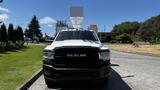 A 2019 RAM 3500 front view showcasing its bold grille and headlights with a mounted equipment on the roof