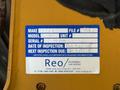 A label on a vehicle detailing specifications including make model unit number serial number inspection date and next inspection date