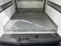 A 2019 Ford Transit Connect interior showing a clean metal floor with diamond plate texture and no cargo present