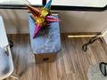 A colorful star-shaped decoration sits on a small table made of dark wood and a marble-like surface inside a camper