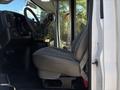 2020 Chevrolet Express front seat and dashboard viewed from the side with a focus on the steering wheel and control panel