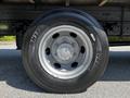 Close-up of a silver wheel from a 2020 Hino 155 showing the tire tread and rim details