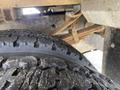 Close-up of a worn tire on a 2015 Ford F-550 showcasing the tread pattern and details of the tire surface