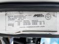 A 2016 Isuzu NQR vehicle identification label displaying specifications including weight and tire dimensions