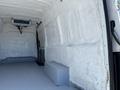 A 2019 Mercedes-Benz Sprinter van interior with an empty cargo space featuring a smooth floor and unpainted walls